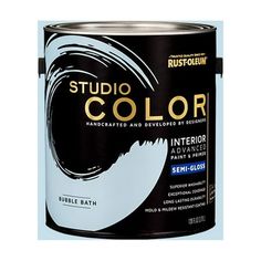 a white paint can with the words studio color in black and gold on it's side