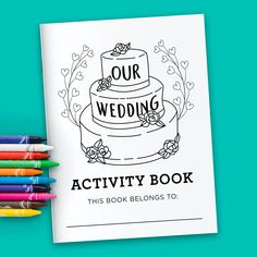 a coloring book with the words our wedding activity book next to colored crayons