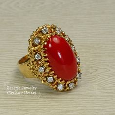 This beautiful oxtail red Coral Ring is set in 14k solid gold and a fancy diamond granulated setting! Ring Size: 7.25 Total Weight: 17.17 grams Precious Metal: 14k solid gold Precious stones: -Coral Center Stone: 20mm x 11mm -White Round diamonds: 0.4 ct Gold Ring Vintage, Oxblood Red, Platinum Diamond Rings, Coral Ring, Solid Gold Ring, Fancy Diamonds, Solid Gold Rings, Platinum Ring, Precious Metal