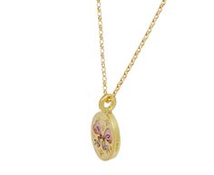 Inspired by the whimsy of Rococo-style paintings, this Cece Jewelry necklace is meant to be worn as a declaration of sweetness and love. The oval, matte 18K yellow gold pendant has a hand-enameled Champlevé enamel pink bow at its center which is surrounded by tiny, star set diamonds. Engraved on the back is a tiny heart pierced by an arrow and surrounded by three additional diamonds. It hangs from the adjustable 18K yellow gold chain and will add a sweet, symbolic vibe to any outfit. total lengt Yellow Gold Enamel Oval Pendant Necklaces, Elegant Yellow Gold Enamel Charm Necklaces, Oval Enamel Locket Necklace, Oval Locket Necklace In Enamel, Pink Gold Necklace With Charms For Gift, Oval Enamel Necklace For Gift, Oval Engraved Enamel Necklace, Yellow Gold Oval Charm Necklace Gift, Yellow Gold Oval Charm Necklace As Gift