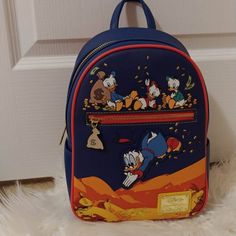 Nwt Price Is Firm Not Accepting Offers Any Offers Will Be Kindly Ignored Or Declined Disney Loungefly Ducktales Coins Mini Backpack Brand New With Tags Selling As Is New With Tags Please See All Pics Discontinued Approx Size 11 1/2" H X 9" W X 5" D No Price Police/No Rude Comments No Trades/No Holds All Items Are Always Triple Protect Before Mailing Out And Pics Are Taken During Packaging And Recorded Smoke Free Home Always Drama Free Zone Fast Shipper Same Day Or Next Day Shipping If Purchased Sleeping Beauty Book, Drama Free Zone, Hello Kitty Pumpkin, Stitch Backpack, Disney Finding Nemo, Disney Loungefly, Mini Mochila, Drama Free, Loungefly Bag