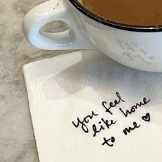 a cup of coffee on top of a napkin with the words you get some life time to me written on it