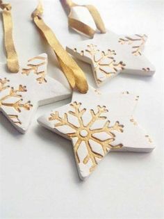 white and gold snowflake ornament with ribbon