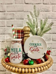 two cookies for santa salt and pepper shakers on a platter with candy canes