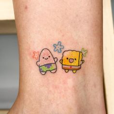 two cartoon tattoos on the side of a woman's leg, one with a spongebob and another with an octopus