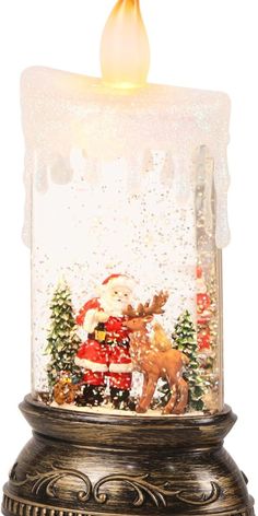 a lighted snow globe with santa and reindeer