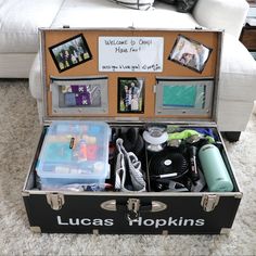 an open suitcase sitting on top of a carpet covered floor