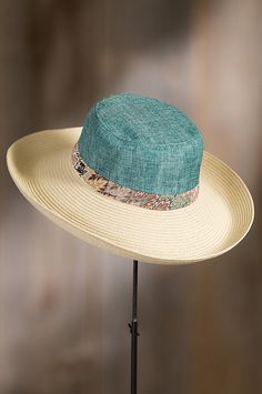 Crafted of Toyo and polyester, this statement piece starts with a gently ventilated crown that’s trimmed with a floral fabric band. Luxury Adjustable Hats For Women, Luxury Adjustable Hat For Outdoor, Luxury Brimmed Straw Hat, Luxury Fitted Straw Hat, Luxury Western Straw Hat, Luxury Brimmed Straw Hat For Outdoor, Luxury Fitted Summer Hat, Luxury Straw Hat, Luxury Fitted Hat Bands For Outdoor