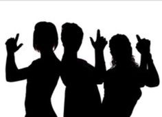 three people are standing in silhouette with their hands up to the side and one person is making an ok sign