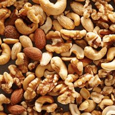 nuts and cashews are mixed together on a table