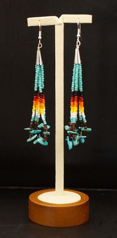 Long handmade Native American beaded earrings with the main color turquoise and other colored beads with turquoise stones. The earrings are handmade in a traditional way by an artist from an Indian tribe. Material: beads, turquoise, sterling silver Dimensions: 80 x 30 mm Closure: hook Condition of the product: NEW Native American Beadwork Earrings, Indigenous Beading, Long Beaded Earrings, Beaded Earrings Diy, Native American Beaded Earrings, Native Beadwork, Earrings Diy, Beaded Earrings Patterns, Native Style