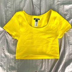 Nwot Never Worn Size Small But Can Fit An Xs Cropped Is This Your First Purchase On Poshmark? Use Promo Code "Giannis_fan" For $10 Off Your First Order! Seamless Short Sleeve Crop Top For Summer, Casual Yellow Seamless Tops, Fitted Yellow Seamless Crop Top, Yellow Seamless Summer Top, Yellow Stretch Short Sleeve Crop Top, Fitted Yellow Scoop Neck Top, Yellow Cropped Stretch Tops, Yellow Clothes, Yellow Fits