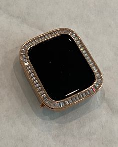 Fits the Apple Watch available for sizes 38mm 40mm 41mm 42mm 44mm 45mm in series 2,3,4,5,6,7,8,9 or SE Men's & Women's. Custom Rose Gold Apple Watch Band with Large High End Crystal Baguettes Stones that are set in a rose gold zinc alloy plated band. This apple watch band features rows high quality High End Swarovski Crystal baguette stones. For the ultimate in sparkle, add the Apple Watch Case in 14k Rose Gold Plated baguette lab diamond bezel. This apple watch band fits wrist sizes from 5" to Rose Gold Apple Watch Band As Gift, Rose Gold Apple Watch Band Gift, Rectangular Rose Gold Apple Watch Band Gift, Luxury Rose Gold Rectangular Apple Watch Band, Apple Watch Bands Rose Gold, Gold Apple Watch Band, Rose Gold Apple Watch, Gold Apple Watch, Gold Apple