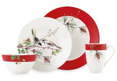 a red and white dinner set with birds on it