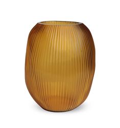 an orange vase with wavy lines on the bottom is shown in front of a white background