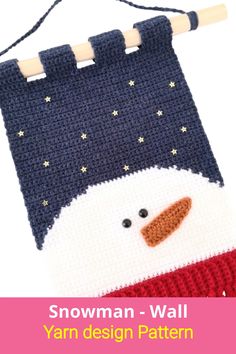 a knitted snowman ornament hanging on a clothes line with text overlay