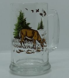 a glass mug with an image of a deer