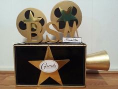 there is a black and gold box with two stars on it, and the words bsw spelled out