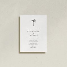 a white wedding card with a palm tree on the front and bottom, in black ink