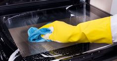 Close up of female hand with yellow protective gloves cleaning oven Cleaning Oven Glass, Putz Hacks, Clean Baking Pans, Commercial Ovens, Dishwasher Tablets, Oven Cleaner