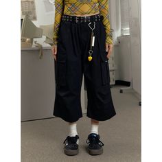 The EZEK Wide Leg Cargo Culottes are high-waisted, loose fit cropped pants featuring multiple pockets for practicality and style. Made from high-quality fabric, these culottes ensure comfort and durability. Perfect for casual wear or adding a trendy touch to your outfit, they offer a versatile and fashionable look. Fabric composition: 100% Nylon Model's measurements: Height 161cm, Weight 42kg, Bust/Waist/Hip 79/58/88, Wearing size M Baggy High-waisted Bottoms With Belt Loops, Black Relaxed Fit Cropped Leg Capris, Black Cropped Wide Leg Summer Pants, Black Cropped Wide Leg Pants For Summer, High Waist Solid Color Baggy Capris, Baggy Cropped Leg Pants With Pockets, Baggy Cropped Pants With Pockets, Casual Black Cotton Culottes, Black Cotton Casual Culottes