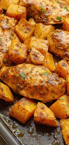 chicken and potatoes in a pan with herbs on the side, ready to be cooked