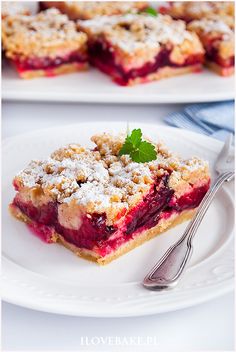 two white plates topped with desserts on top of each other