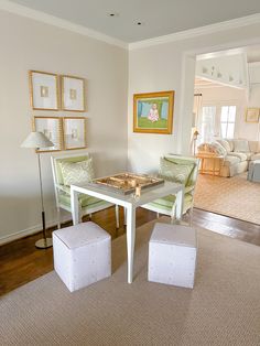 a living room with two chairs and a table