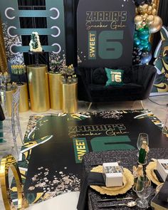 a table set up for a st patrick's day celebration with gold and green decorations