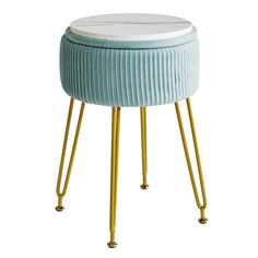 a blue stool with gold legs and a white top