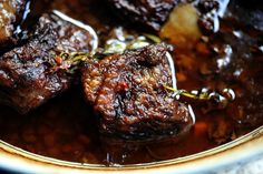 some meat is sitting in a bowl on the table