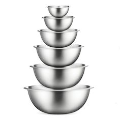 five stainless steel bowls stacked on top of each other in front of a white background