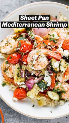 a bowl filled with shrimp and vegetables on top of rice