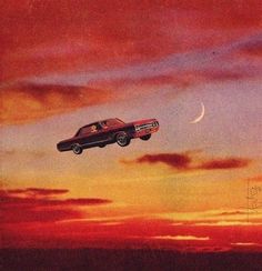 a car flying through the air at sunset with a half moon in the sky behind it