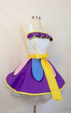 a dress made to look like a princess with purple and yellow trims on it