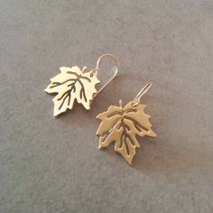 Simple Leaf Earrings, canada earrings, dangle and drop earrings. Made of 24k gold plated brass base, matte finish. Dimensions: Length: 0.4 inch 1 cm Width: 0.4 inch 1 cm Item will be shipped in a branded gift box. Complete the look with the matching Golden Necklace To view matching necklace click here: https://www.etsy.com/listing/279382012 To continue shopping, check out my Etsy store: https://www.etsy.com/shop/HilaAssaJewelry For more earrings click here: https://www.etsy.com/shop/HilaAssaJewe Lexus Coupe, Leaf Earrings Gold, Jewelry Set Design, Gold Leaf Earrings, Bridal Gold Jewellery Designs, Jewelry Earring, Leaf Jewelry, Tiny Stud Earrings, Gold Earrings Designs