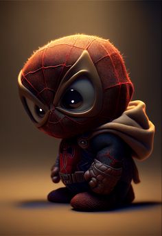 a little spiderman sitting on the ground with his eyes wide open and wearing a cape