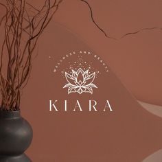 a vase with some branches in it and the word klara on top of it