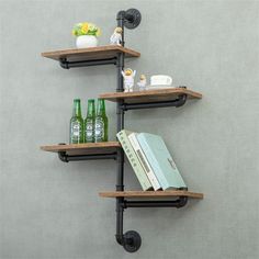 three shelves with books and drinks on them