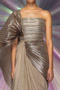 Gold metallic structured striped saree gown with hand woven palla in metallic polymer.
Component: 1
Type Of Work: Stripes
Neckline: Straight
Sleeve Type: Sleeveless
Fabric: Striped Fabric, Mesh
Color: Gold
Other Details: 
Metallic stripes
Closure: Back zip
Occasion: Sangeet, Destination Wedding - Aza Fashions Gowns Gold, Striped Saree, Amit Aggarwal, Saree Gowns, Gown Gold, Gown For Women, Saree Gown, Drape Saree, Womens Wedding Dresses