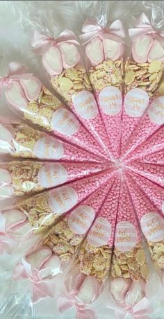 pink and gold candy sticks arranged in a circle