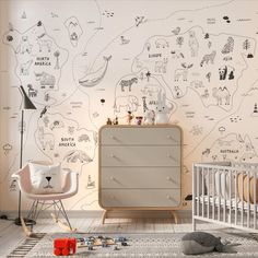 a baby's room with a map wallpaper