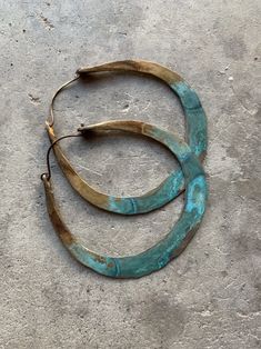 "Solid 8 gauge brass has been hand-hammered into large hoops. I then added several layers of grungy turquoise patina and oxidized the entire hoop for a rustic look. Hypoallergenic niobium earwires 2.5\" wide and 2.75\" long Handmade in NY" Artisan Small Hoop Earrings, Artisan Copper Hoop Earrings, Pierced, Artisan Copper Hoop Earrings, Unique Metal Hoop Earrings, Handmade Bronze Hoop Jewelry, Unique Small Hoop Copper Earrings, Bronze Hoop Pierced Earrings, Artisan Small Hoop Hand Forged Earrings, Artisan Small Hoop Metal Earrings