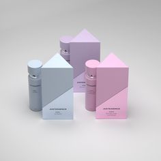 five different shades of pink, blue, and white packaging on a grey background with the same color