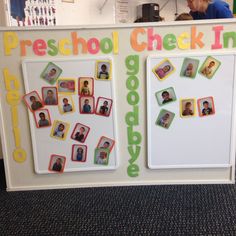 a school check in counter with pictures and magnets on the back wall, as well as children's photos