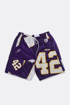 Unisex American Football shorts upcycled from a Minnesota Vikings jersey patchwork pieces and deadstock mesh. Featuring pockets and an elasticized waistband with drawstrings. Sourced and reworked in Canada DetailsSize: Women's L, Men's MCondition: Good vintage conditionMaterial Composition: 100% polyesterColour: Purple, yellow Streetwear Patchwork Bottoms, Short Patchwork Bottoms For Streetwear, Jersey Patchwork, Frankie Collective, Nfl Jersey, Minnesota Vikings, American Football, Jersey Shorts, Minnesota