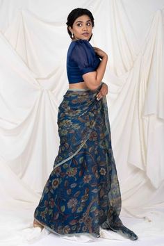 Indigo blue saree with all over hand painted floral kalamkari pattern, elevated with lace border. Comes along with an unstitched blouse piece. - Aza Fashions Traditional Fitted Pre-draped Saree With Floral Print, Traditional Pre-draped Saree With Floral Print For Designer Wear, Traditional Blue Lehenga With Floral Print, Traditional Blue Floral Print Lehenga, Fitted Chanderi Dupatta With Kalamkari Print, Fitted Cotton Silk Dupatta With Kalamkari Print, Fitted Kalamkari Print Cotton Silk Dupatta, Blue Sets With Kalamkari Print And Traditional Drape, Fitted Chanderi Traditional Wear With Kalamkari Print