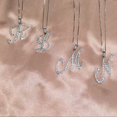 Silver Rhinestone Initial Necklaces With A Lobster Clasp. Cz (Cubic Zirconia) Pave Pendent Necklace. Also Available In Gold For Certain Letters Only. Approx Length: 22 Made In Korea Initial Jewelry Silver, Heart Stone Necklace, Purple Stone Necklace, Rose Gold Chain Necklace, Ruby And Diamond Necklace, Initial Necklace Silver, Gold Collar Necklace, Diamond Initial Necklace, Initial Necklaces