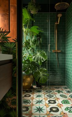 a green tiled bathroom with plants in the shower stall and floor tiles on the walls