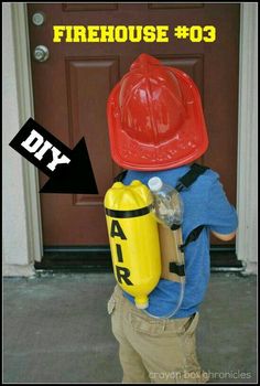 a young boy wearing a fireman's hat and carrying a water bottle